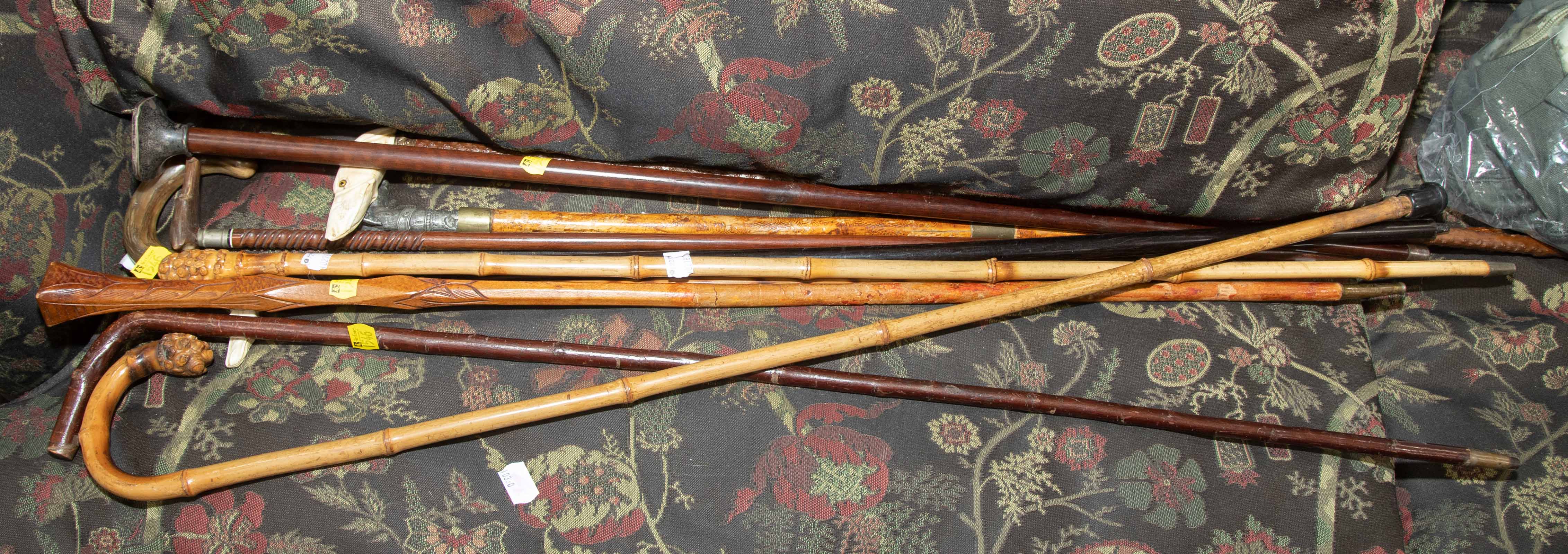 Appraisal: CANES WALKING STICKS Includes one with sterling top two with