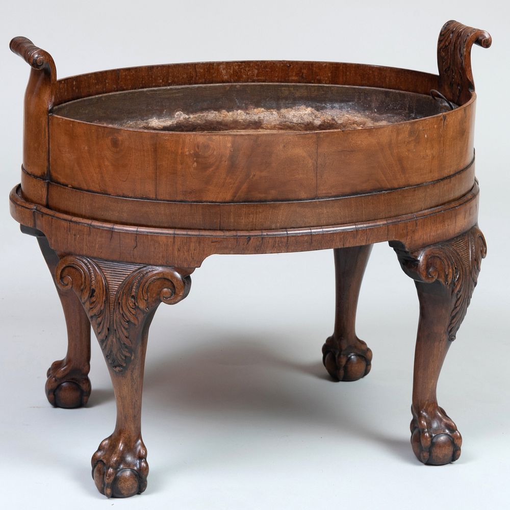 Appraisal: George II Carved Mahogany Bottle Carrier Fitted with a metal