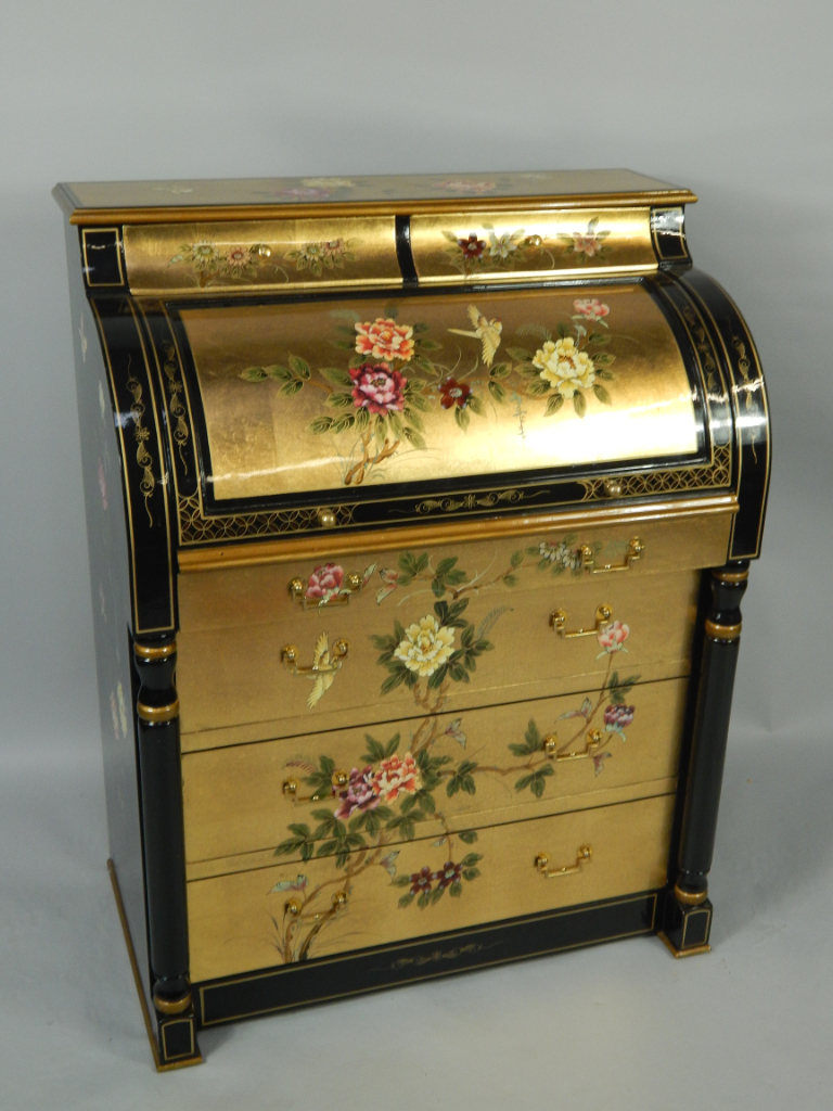 Appraisal: A gilt and black lacquered cylinder bureau with two cushion