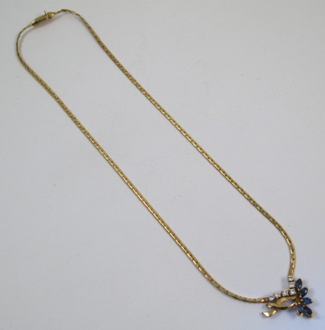 Appraisal: SAPPHIRE AND DIAMOND PENDANT NECKLACE the pendant is set between