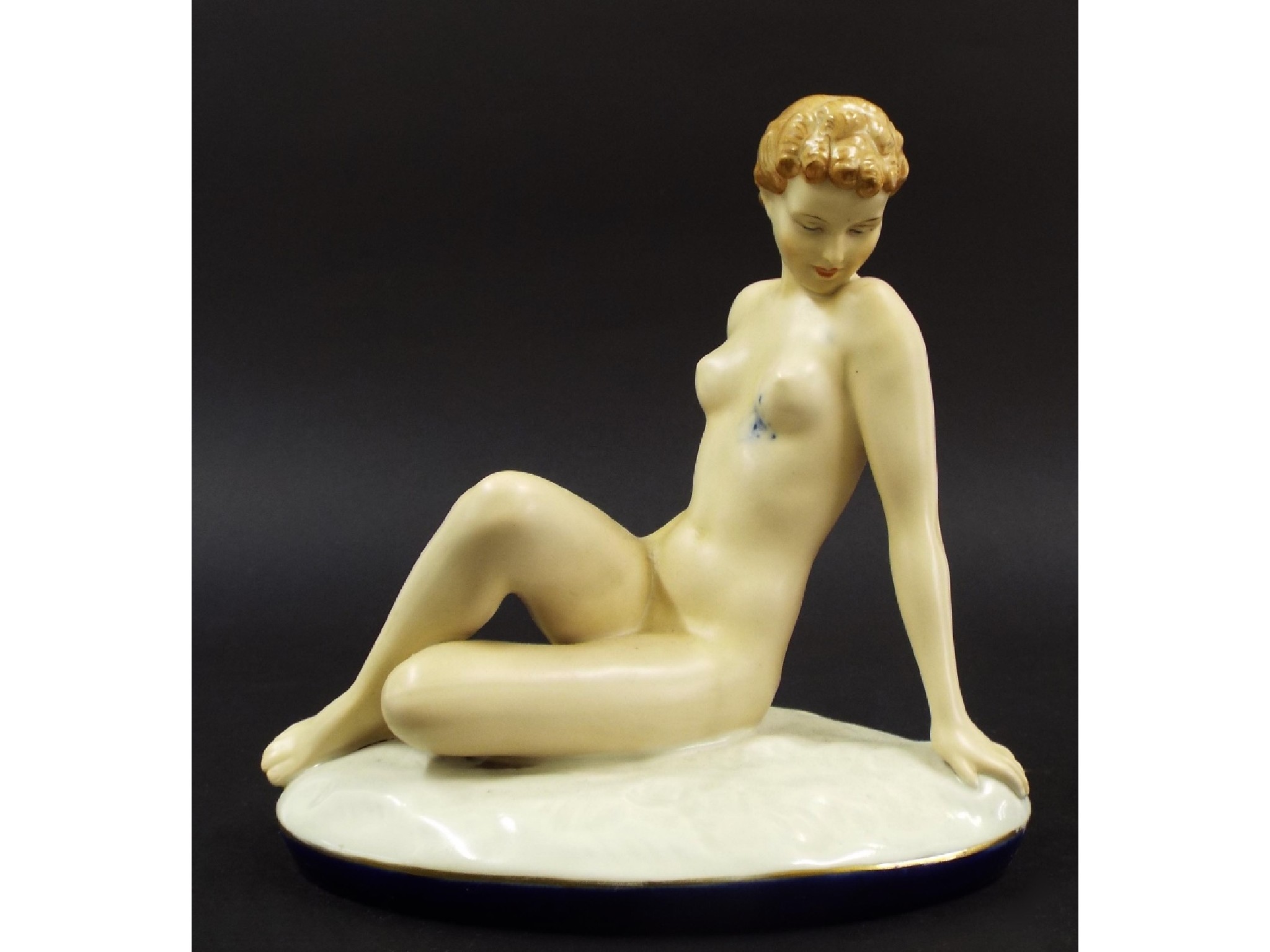 Appraisal: Royal Dux figure of a reclining nude triangular mark to