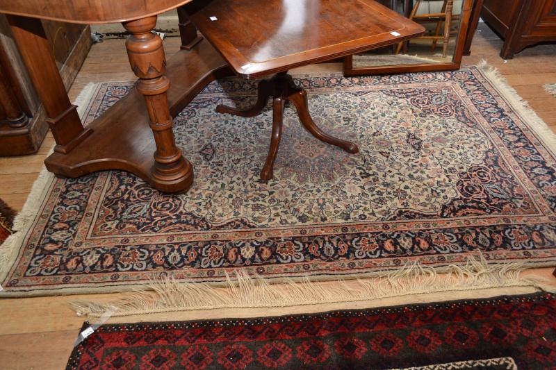 Appraisal: A PERSIAN STYLE WOOL CARPET IN BLUE AND CREAM A