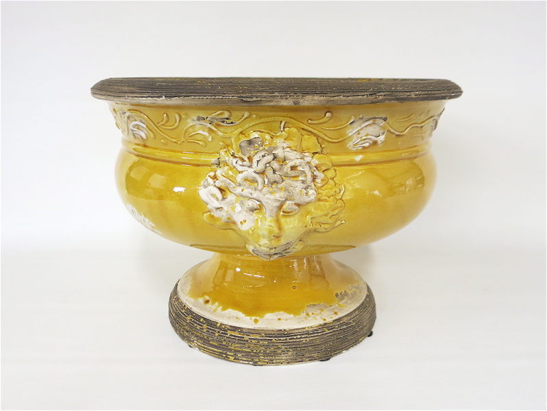 Appraisal: ITALIAN POTTERY FOOTED CENTERPIECE BOWL having yellow glaze and applied