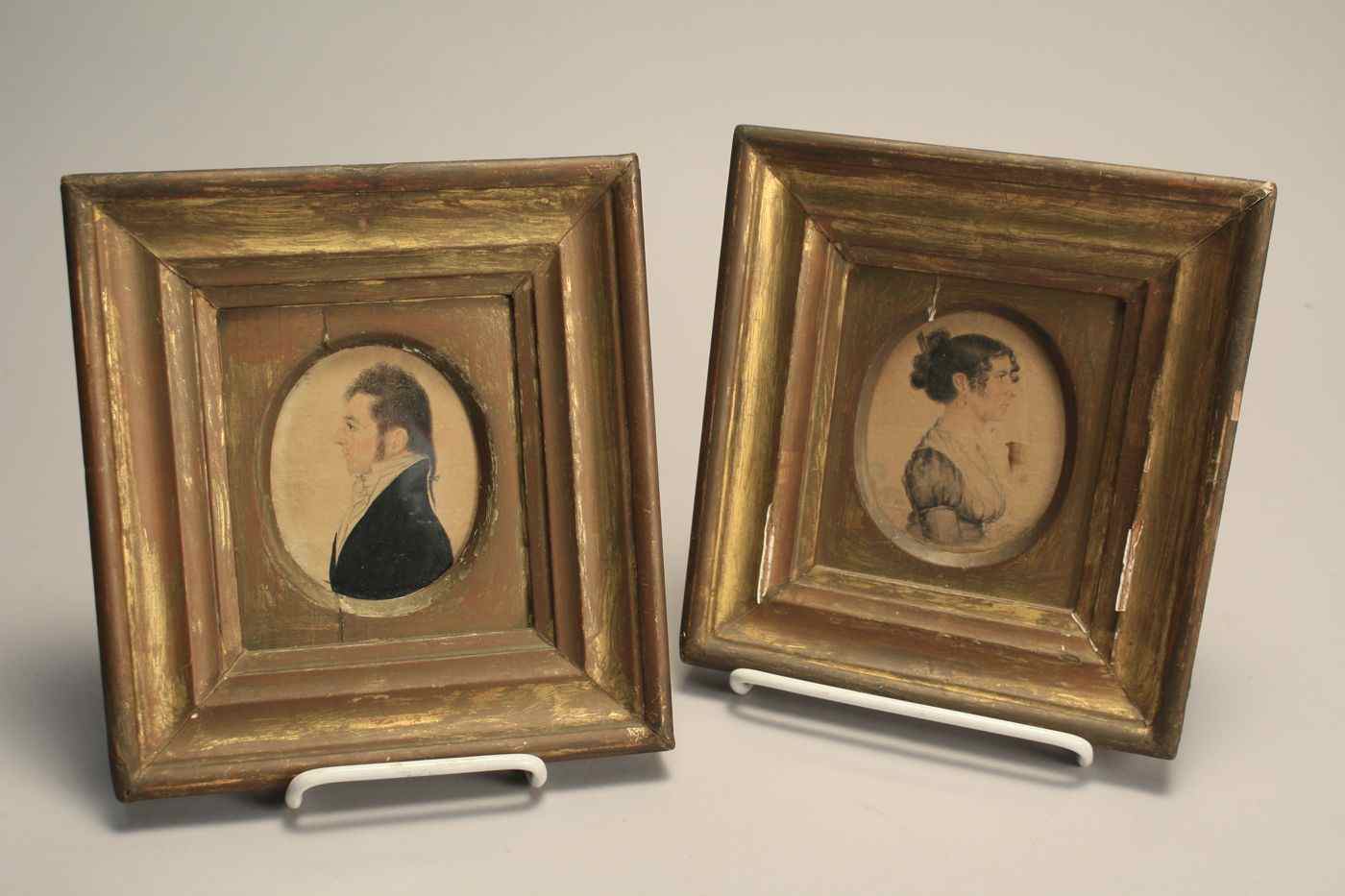 Appraisal: PAIR OF FRAMED MINIATURE OVAL PORTRAITSEarly th CenturyA man and