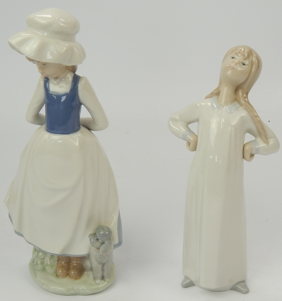 Appraisal: Nao and Lladro figurines comprising young girl with poodle and