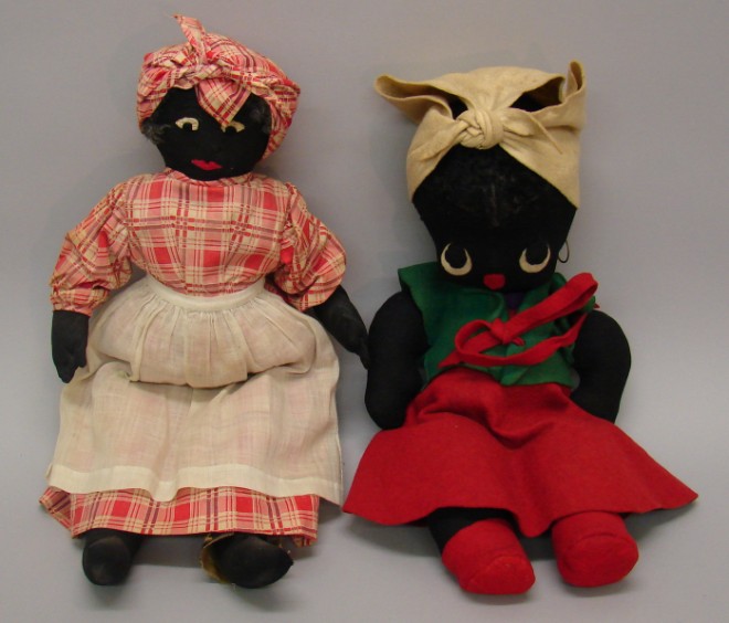 Appraisal: Pair of 's black cloth dolls Folk art Mammy style