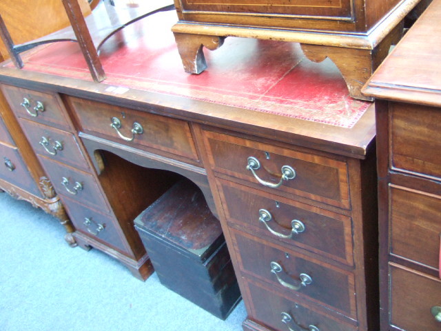 Appraisal: A late th century mahogany and satin wood banded knee