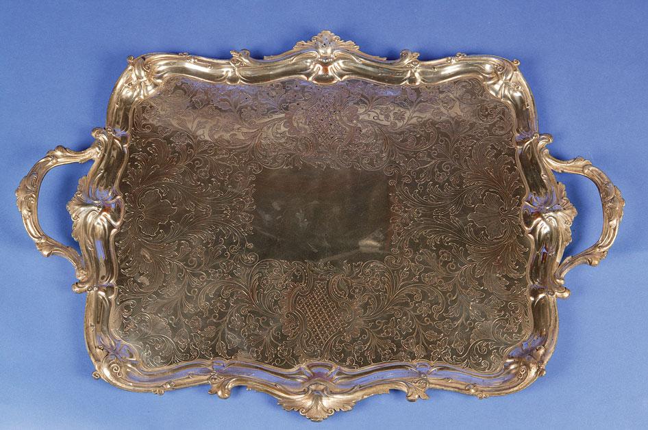 Appraisal: A VICTORIAN ELECTRO-PLATED TRAY of shaped rectangular form with raised