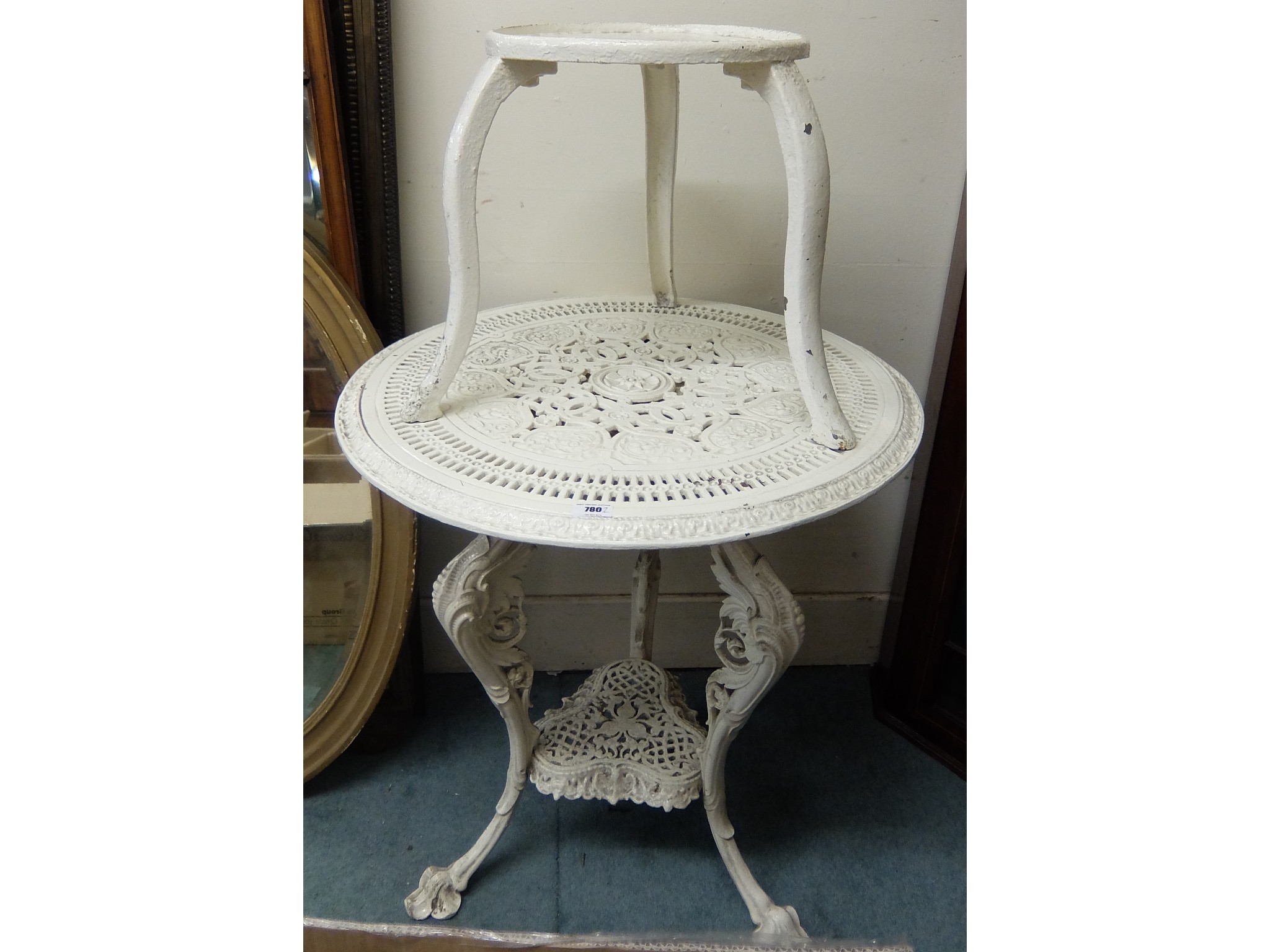 Appraisal: Victorian painted cast iron garden table with a painted cast