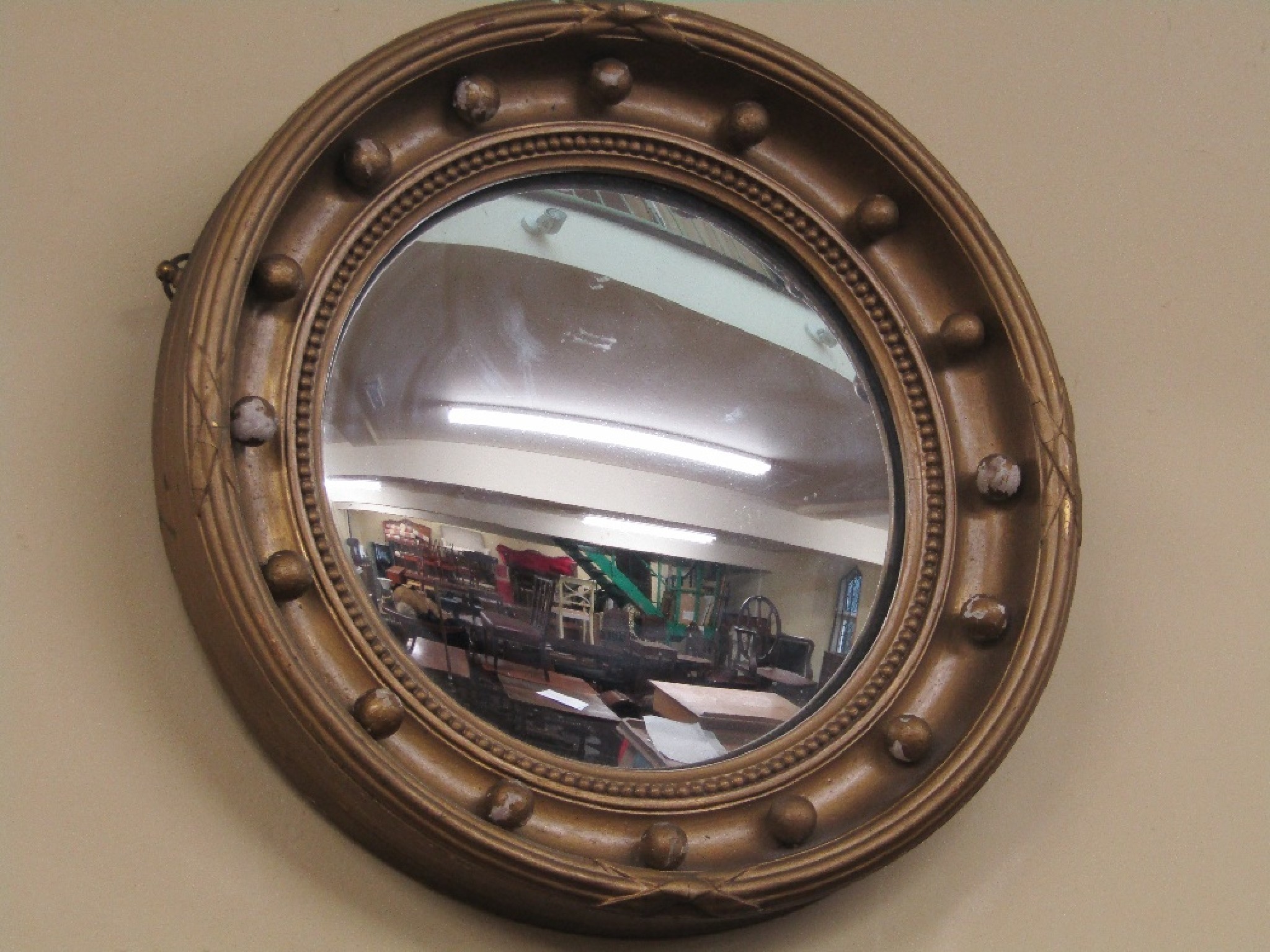 Appraisal: A th century convex wall mirror of usual form the