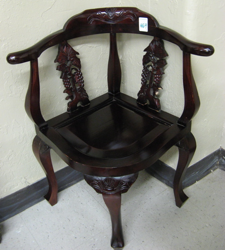 Appraisal: A PAIR OF MAHOGANY CORNER ARMCHAIRS with horseshoe arms carved