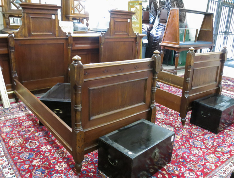 Appraisal: A PAIR OF VICTORIAN WALNUT TWIN BEDS WITH ORIGINAL RAILS