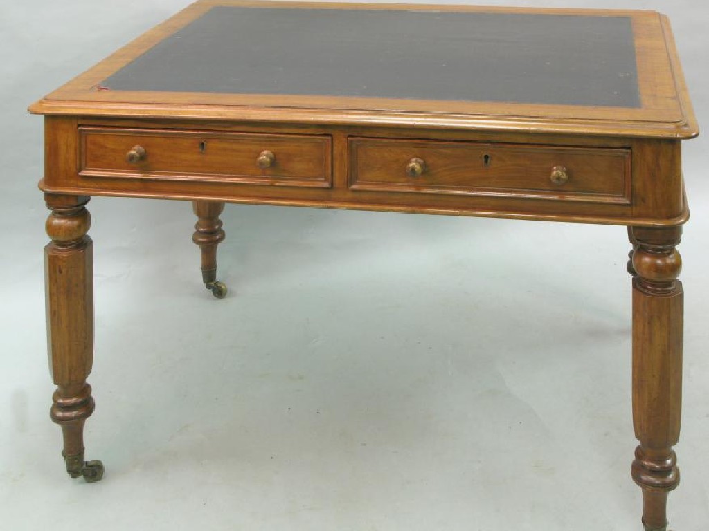 Appraisal: A Victorian mahogany writing table with inset tooled vinyl top