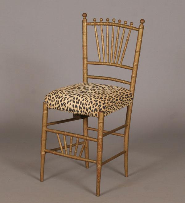 Appraisal: Opera chair with faux leopard upholstery faux bamboo frame