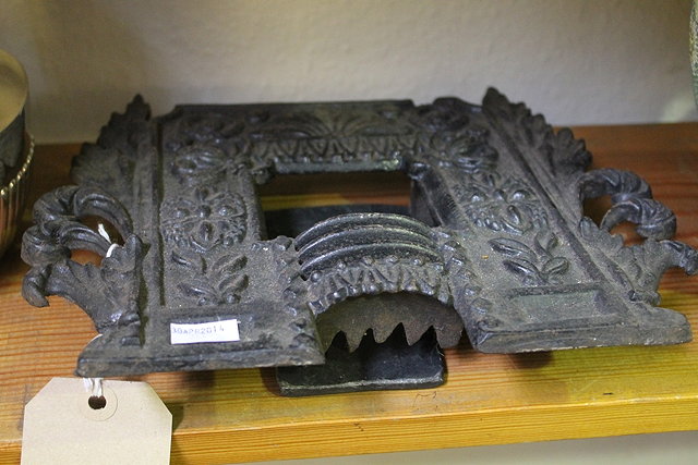 Appraisal: A MINIATURE CAST IRON MODEL OF A FIRE SURROUND with