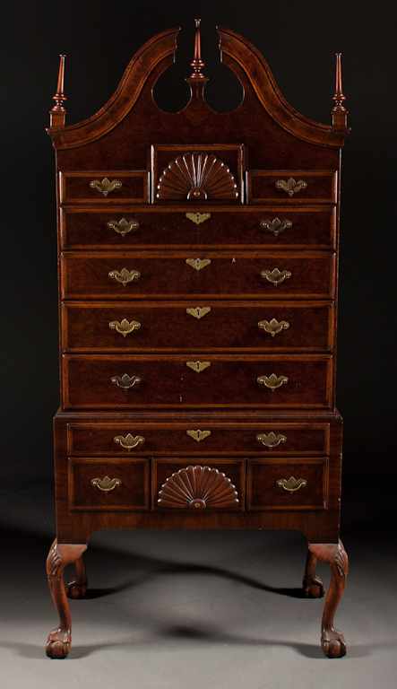 Appraisal: Georgian style banded rosewood highboy with ball and claw feet