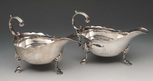 Appraisal: A PAIR OF GEORGE III SILVER SAUCE BOATS with scroll