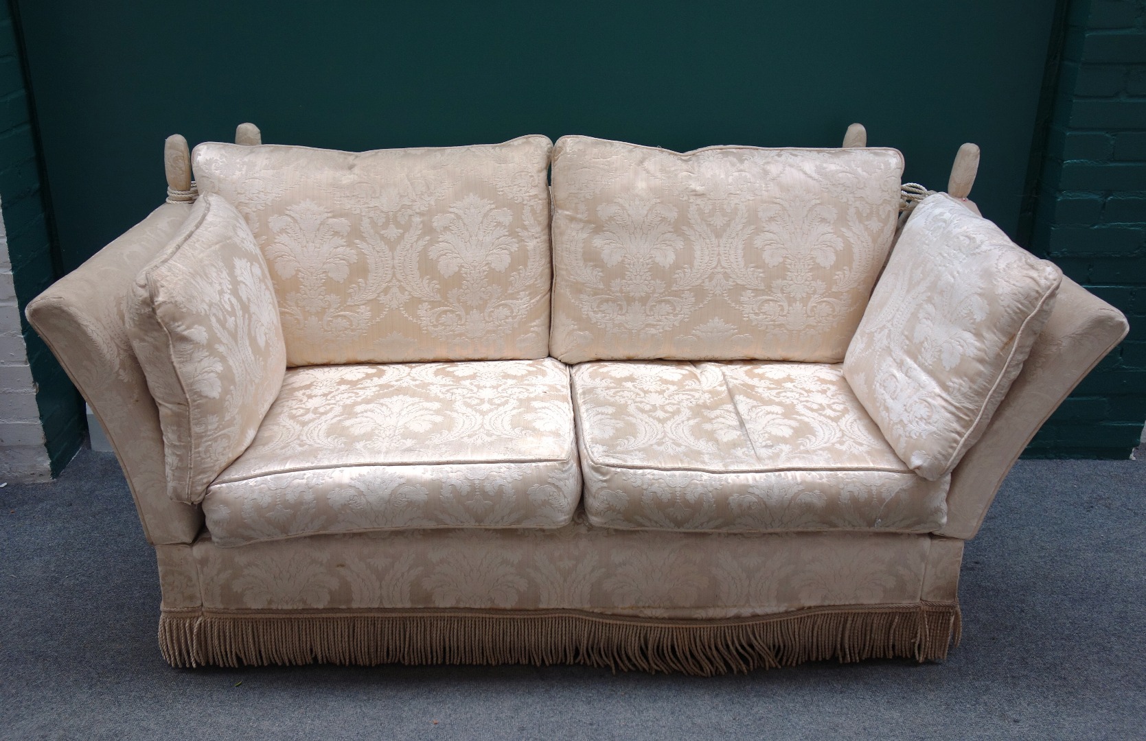 Appraisal: A pair of th century patterned cream upholstered Knole sofas