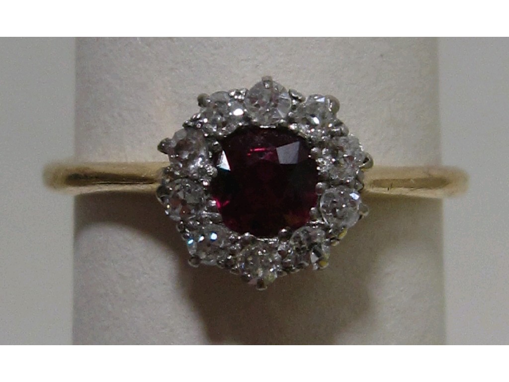 Appraisal: Eighteen carat gold ruby and diamond cluster ring