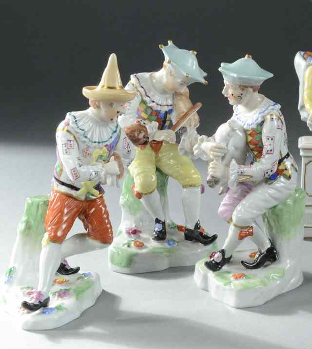 Appraisal: THREE DRESDEN PORCELAIN COURT JESTER FIGURES man playing fiddle another