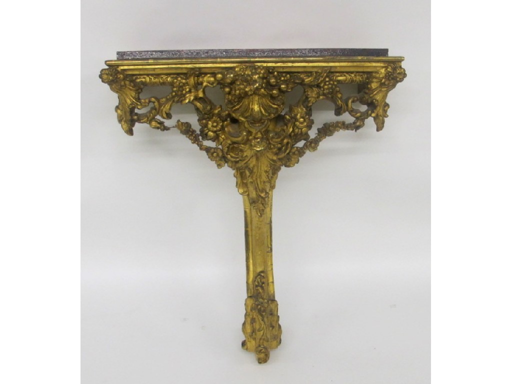 Appraisal: A th Century giltwood and gesso pier table carved with