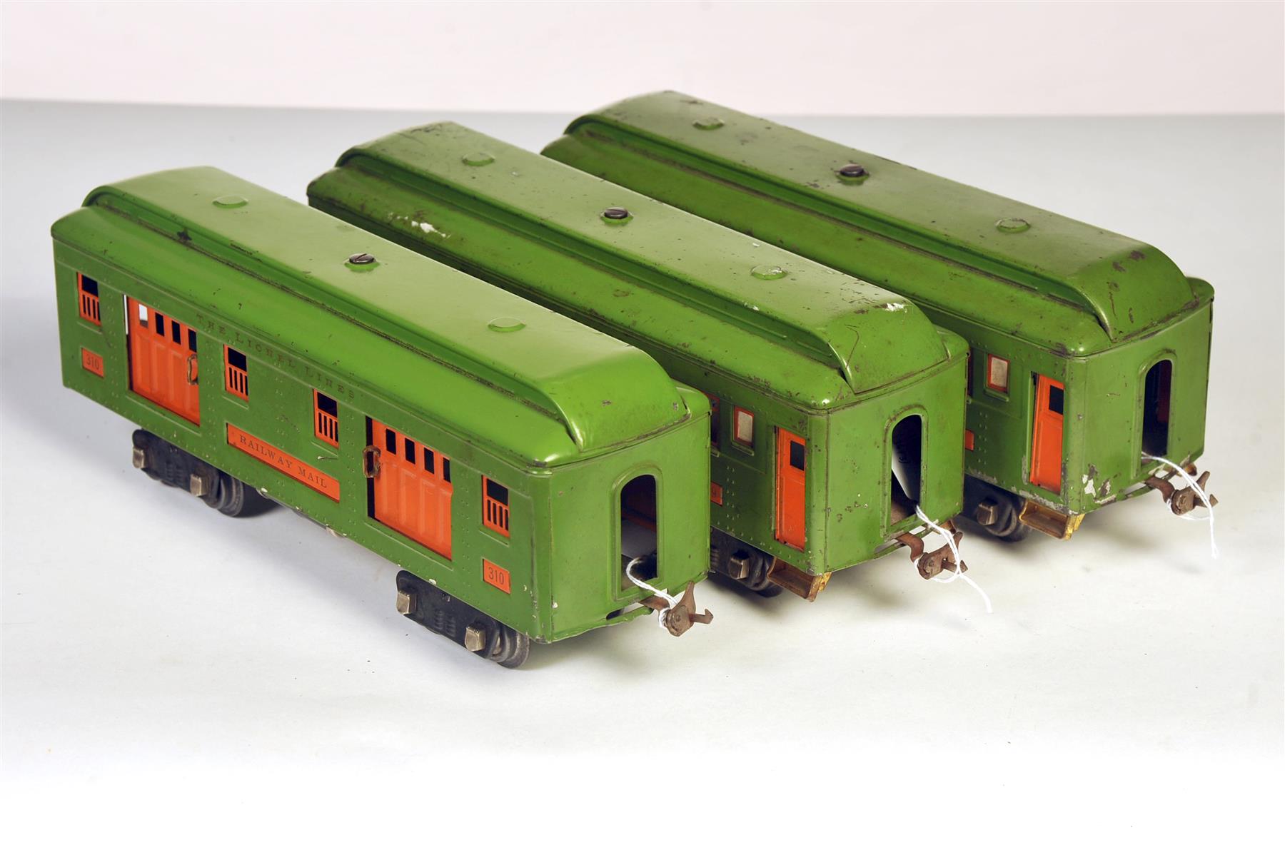 Appraisal: THREE LIONEL STANDARD GAUGE PASSENGER CARS INCLUDING COMBINE BAGGAGE PULLMAN