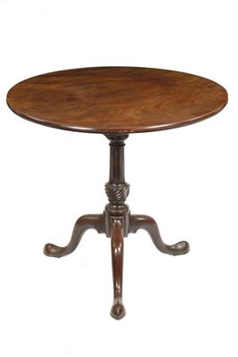 Appraisal: A George III mahogany tripod table the circular snap-top revolving