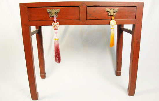 Appraisal: A Chinese Red Painted Table having two drawers with brass