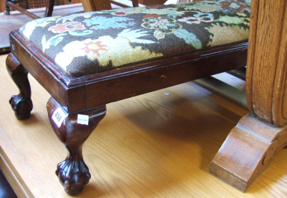 Appraisal: An early th century rectangular mahogany footstool with needlework drop-in