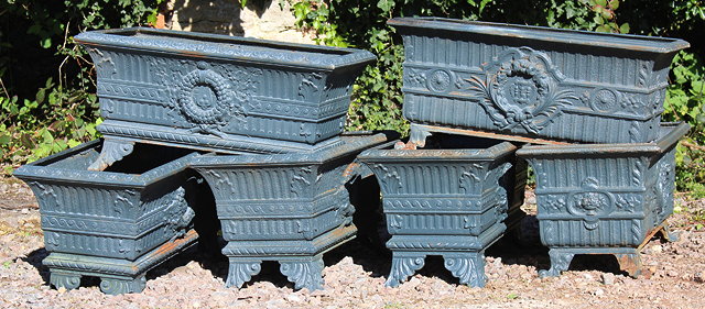 Appraisal: SIX REGENCY STYLE CAST IRON RECTANGULAR PLANTERS each of tapering