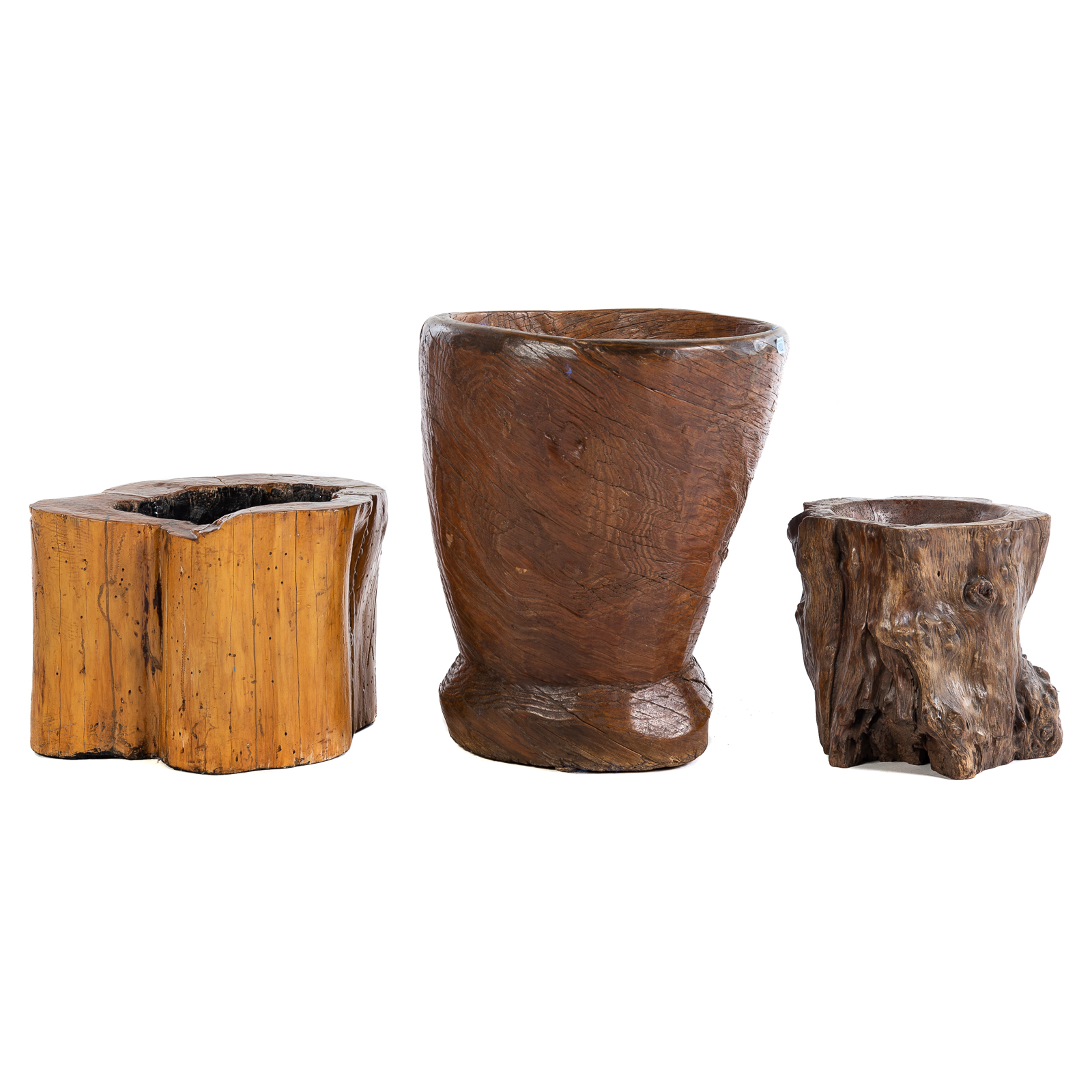 Appraisal: THREE CARVED TREE TRUNK PLANTERS Hollowed out and carved natural