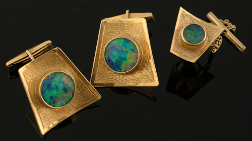 Appraisal: A pair of opal cufflinks and tie tack Of abstract