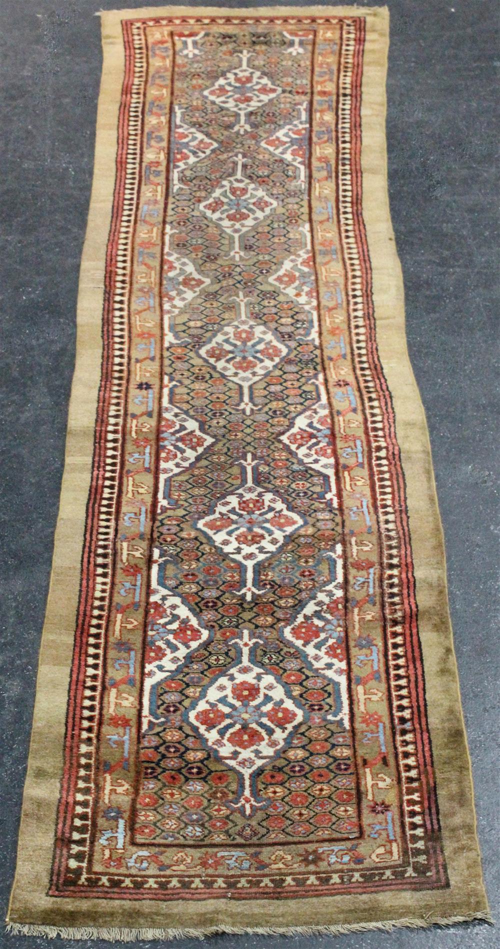 Appraisal: CAUCASIAN KARABAGH WOOL RUNNER WITH FIVE FLORAL MEDALLIONS with multiple