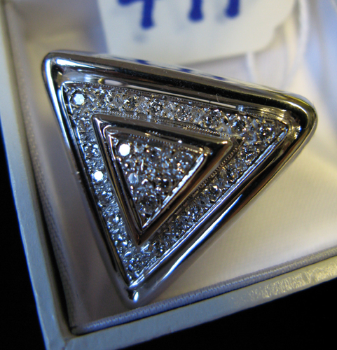 Appraisal: DIAMOND AND FOURTEEN KARAT WHITE GOLD PENDANT triangle shaped and