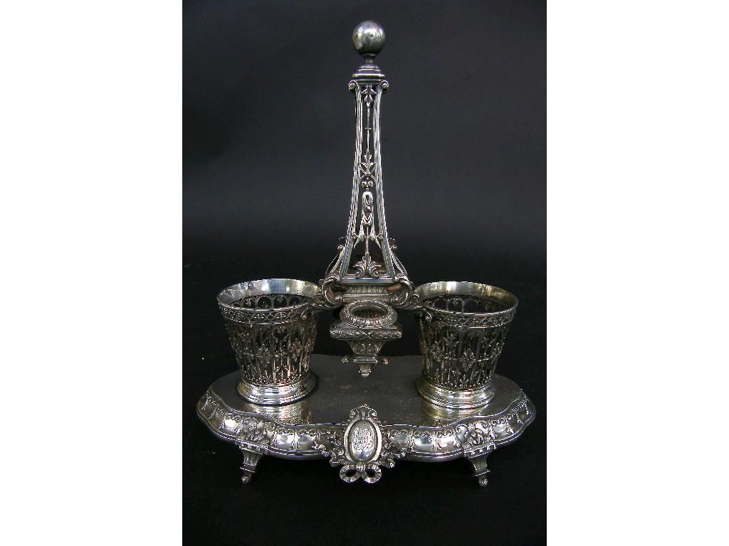 Appraisal: Continental white metal two bottle cruet stand the raised pierced