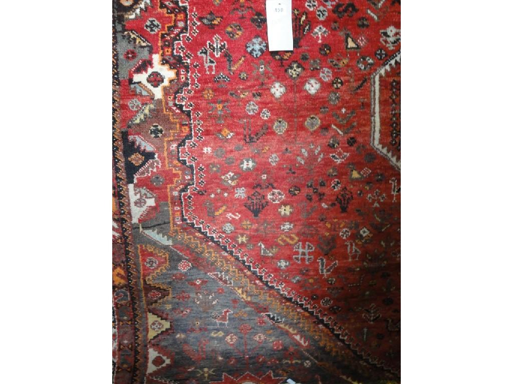 Appraisal: A Middle Eastern rug with a central interlocking three medallion