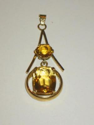 Appraisal: A CITRINE PENDANT with a round cut and a cushion