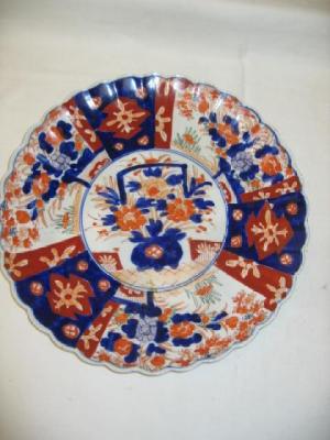 Appraisal: AN IMARI CHARGER of lobed octagonal form painted with panels