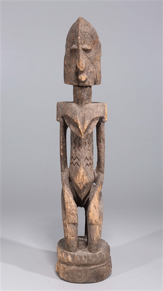 Appraisal: Early th Century African carved wood kneeling Dogon figure carved