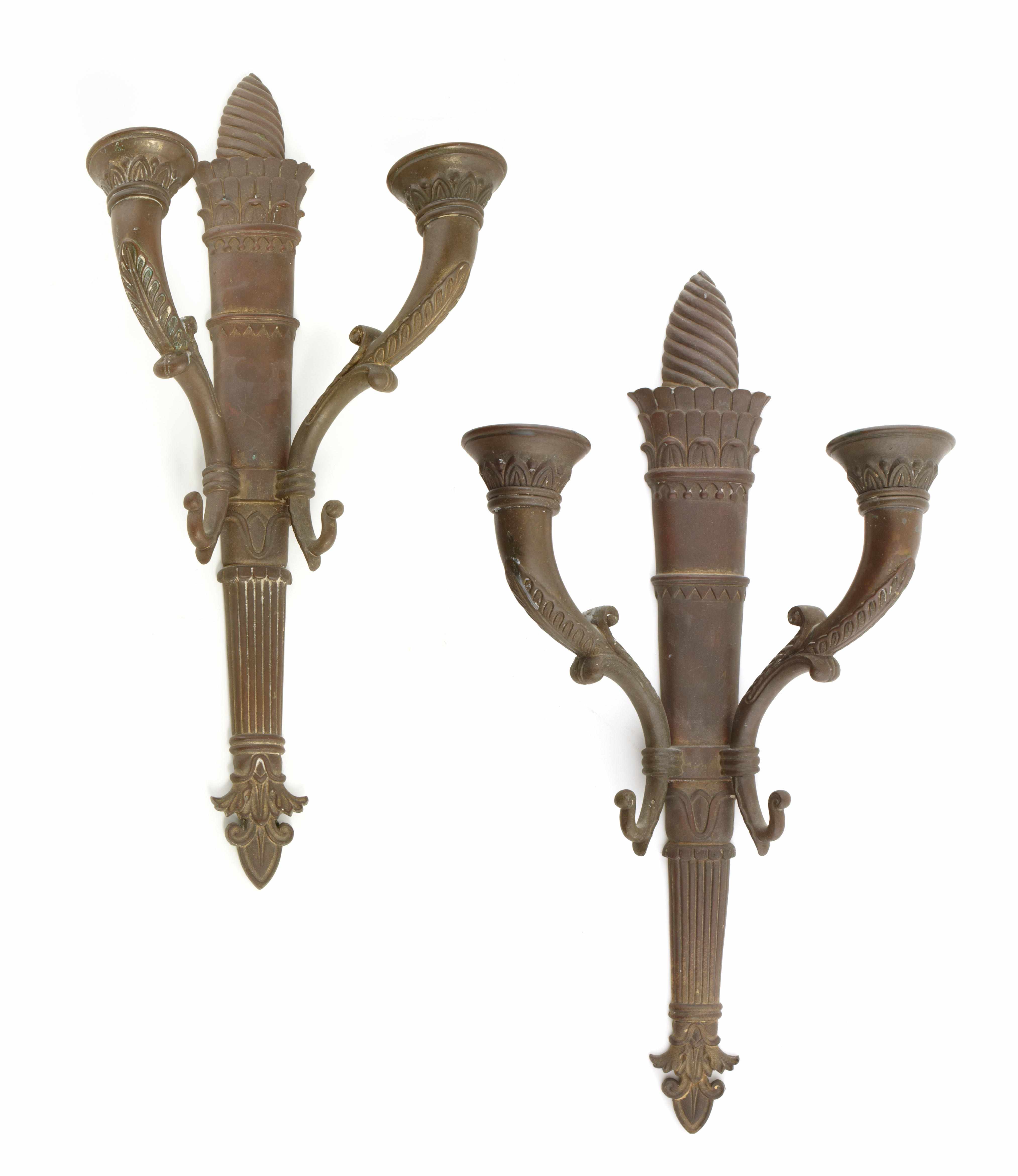 Appraisal: A pair of Empire style patinated bronze parcel gilt two