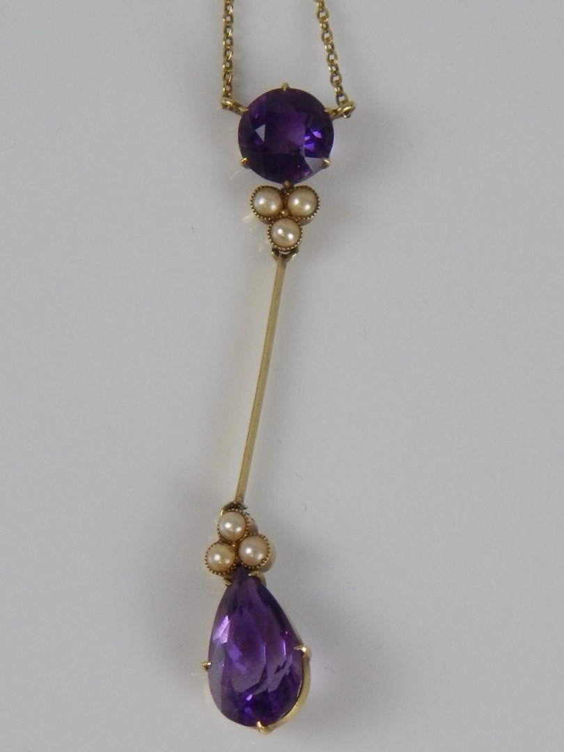 Appraisal: An amethyst and seed pearl drop necklace on fine link