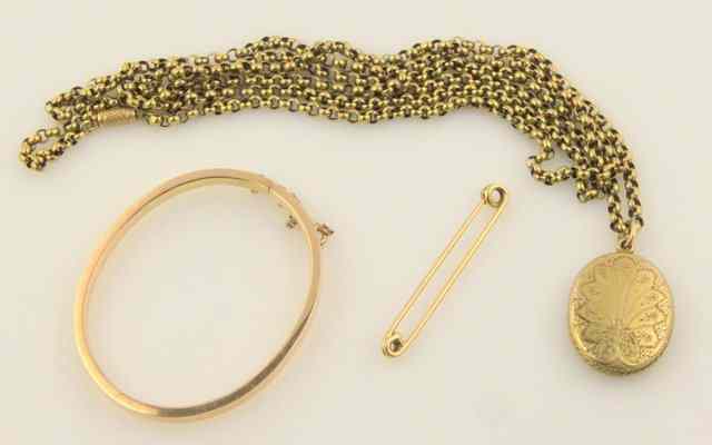 Appraisal: A ct gold bangle hinged and with safety chain a