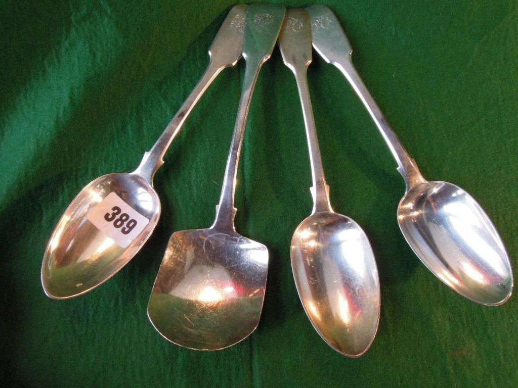 Appraisal: Three silver George III fiddle back serving spoons London and