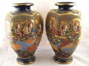 Appraisal: A pair of Japanese ceramic hexagonal baluster vases with traditional