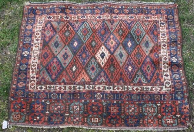 Appraisal: EARLY TH C CAUCASIAN SCATTER RUG WITH GEOMETRICDESIGN OVERALL MODERATE