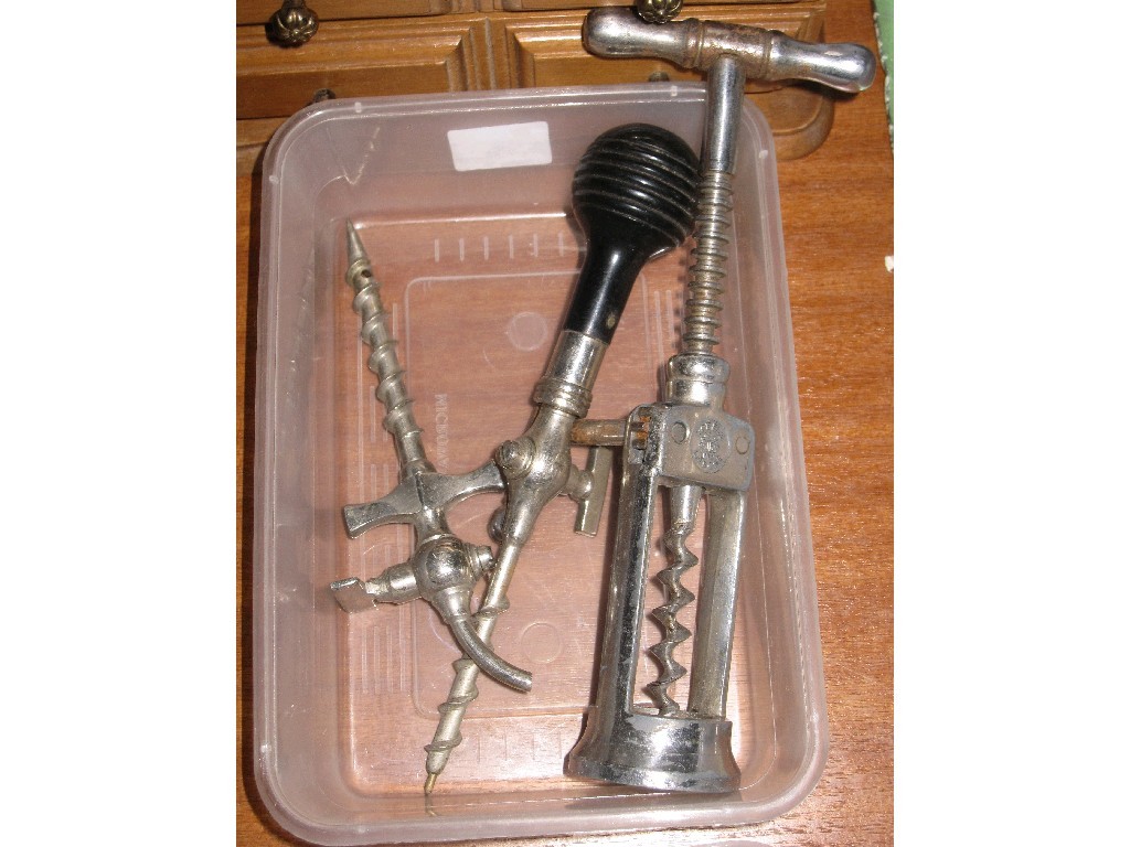 Appraisal: Lot comprising corkscrew and two barrel taps