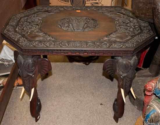 Appraisal: Burmese carved wood table with elephant head-form legs with ivory