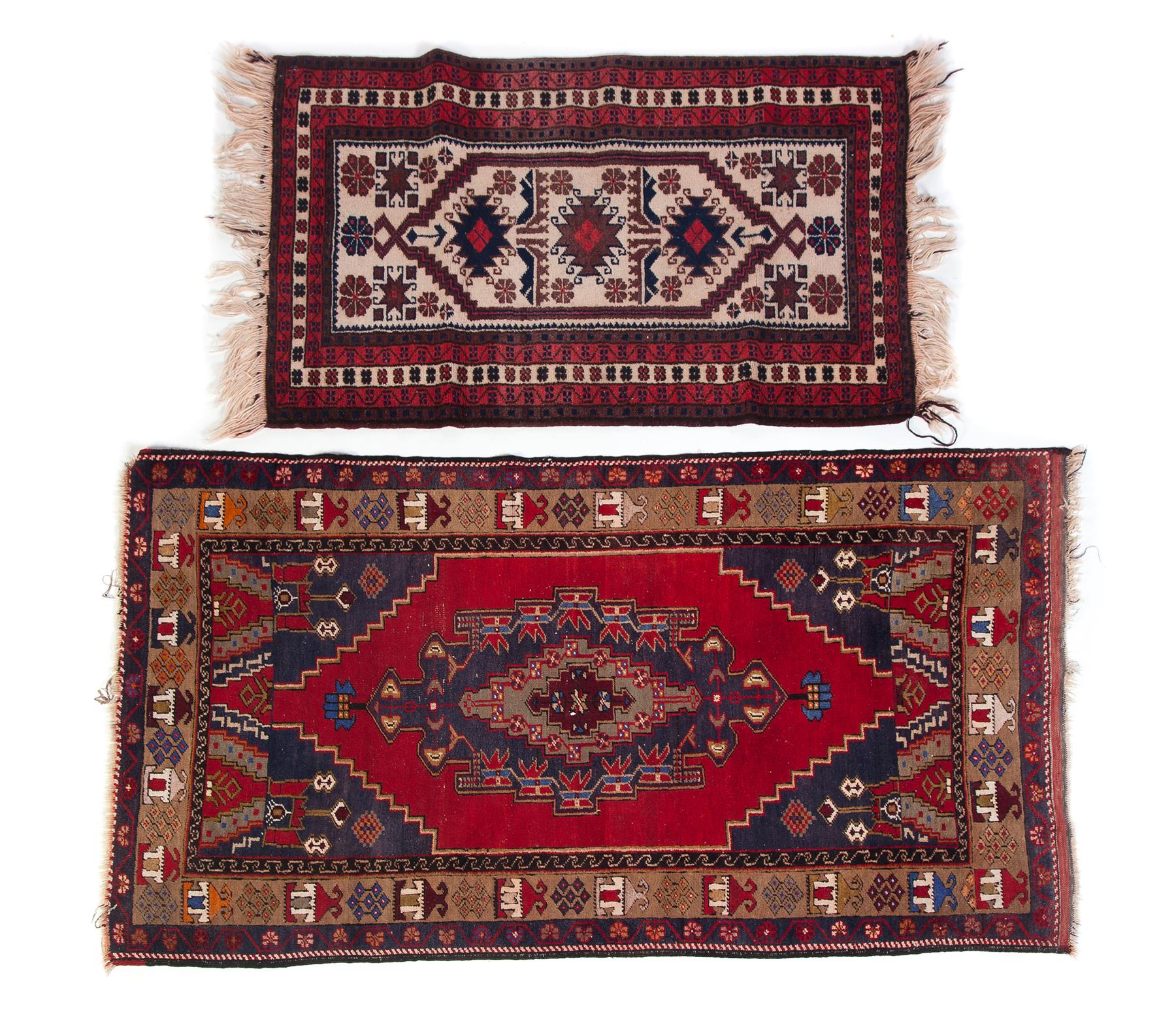 Appraisal: TWO HANDMADE ORIENTAL AREA RUGS Twentieth century Geometric patterns in