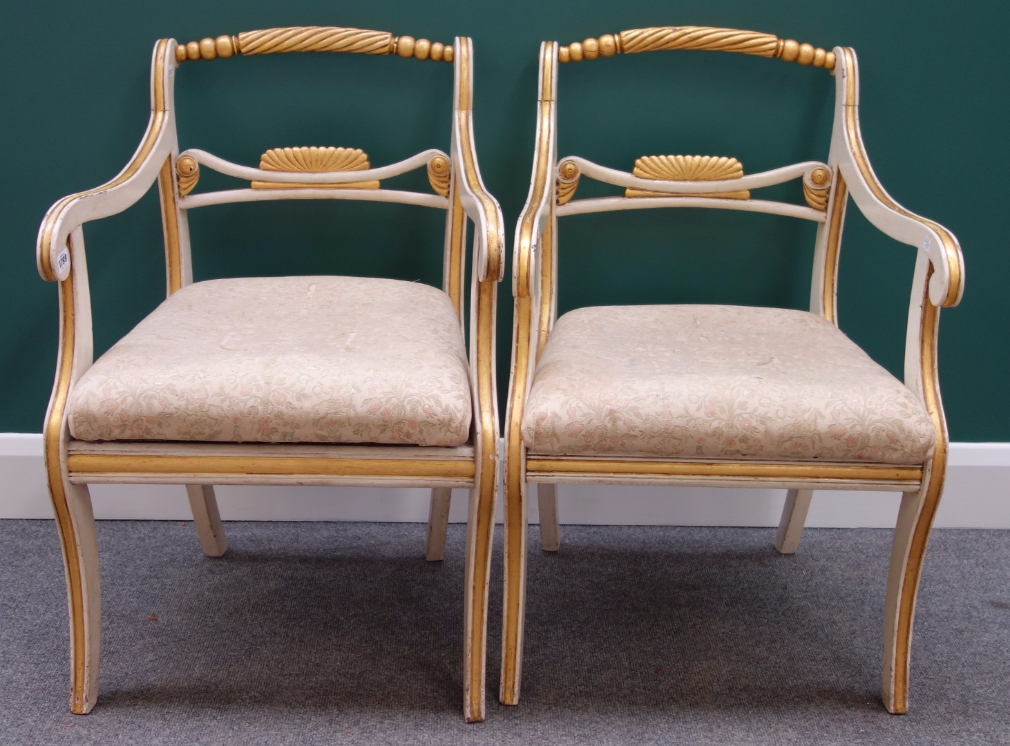 Appraisal: A pair of Regency style cream painted parcel gilt open