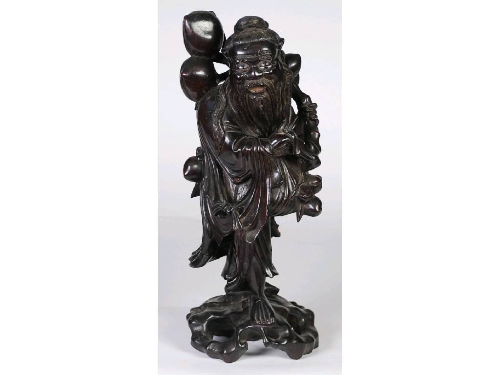 Appraisal: EARLY TWENTIETH CENTURY CHINESE CARVED REDWOOD FIGURE OF A SAGE